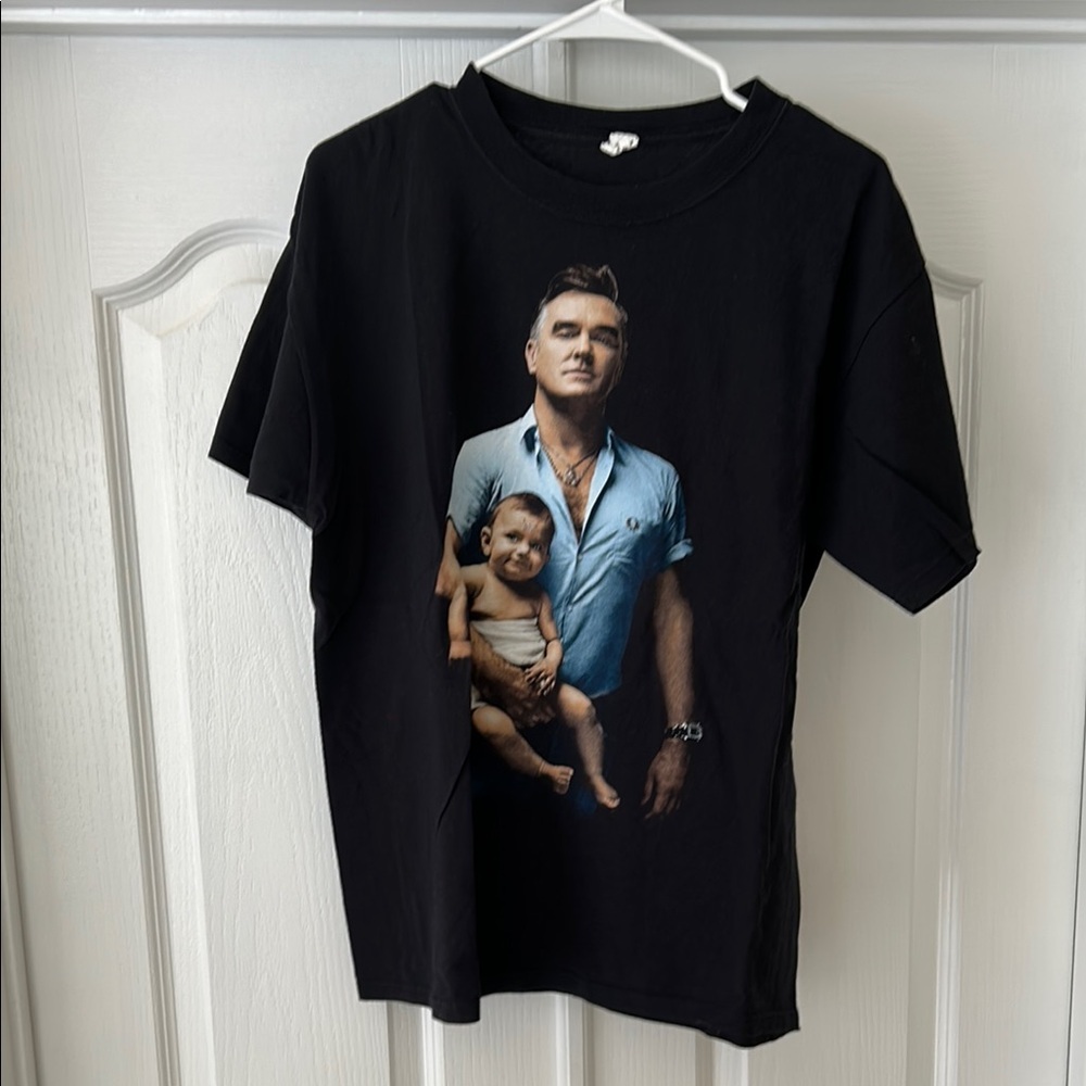 Morrissey Tour Tshirt
Black Graphic T-Shirt with Portrait Design
Size L